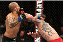 NOTTINGHAM, ENGLAND - SEPTEMBER 29:  (R-L) Andy Ogle punches Akira Corassani during their featherweight fight at the UFC on Fuel TV event at Capital FM Arena on September 29, 2012 in Nottingham, England.  (Photo by Josh Hedges/Zuffa LLC/Zuffa LLC via Getty Images)