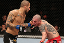 NOTTINGHAM, ENGLAND - SEPTEMBER 29:  (L-R) Akira Corassani punches Andy Ogle during their featherweight fight at the UFC on Fuel TV event at Capital FM Arena on September 29, 2012 in Nottingham, England.  (Photo by Josh Hedges/Zuffa LLC/Zuffa LLC via Getty Images)