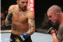 NOTTINGHAM, ENGLAND - SEPTEMBER 29:  (L-R) Akira Corassani punches Andy Ogle during their featherweight fight at the UFC on Fuel TV event at Capital FM Arena on September 29, 2012 in Nottingham, England.  (Photo by Josh Hedges/Zuffa LLC/Zuffa LLC via Getty Images)