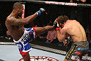 NOTTINGHAM, ENGLAND - SEPTEMBER 29:  (L-R) Jimi Manuwa kicks Kyle Kingsbury during their light heavyweight fight at the UFC on Fuel TV event at Capital FM Arena on September 29, 2012 in Nottingham, England.  (Photo by Josh Hedges/Zuffa LLC/Zuffa LLC via Getty Images)