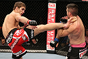 NOTTINGHAM, ENGLAND - SEPTEMBER 29:  (L-R) John Hathaway kicks John Maguire during their welterweight fight at the UFC on Fuel TV event at Capital FM Arena on September 29, 2012 in Nottingham, England.  (Photo by Josh Hedges/Zuffa LLC/Zuffa LLC via Getty Images)