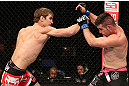 NOTTINGHAM, ENGLAND - SEPTEMBER 29:  (L-R) John Hathaway punches John Maguire during their welterweight fight at the UFC on Fuel TV event at Capital FM Arena on September 29, 2012 in Nottingham, England.  (Photo by Josh Hedges/Zuffa LLC/Zuffa LLC via Getty Images)