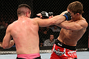 NOTTINGHAM, ENGLAND - SEPTEMBER 29:  (L-R) John Maguire punches John Hathaway during their welterweight fight at the UFC on Fuel TV event at Capital FM Arena on September 29, 2012 in Nottingham, England.  (Photo by Josh Hedges/Zuffa LLC/Zuffa LLC via Getty Images)