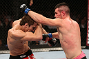 NOTTINGHAM, ENGLAND - SEPTEMBER 29:  (R-L) John Maguire punches John Hathaway during their welterweight fight at the UFC on Fuel TV event at Capital FM Arena on September 29, 2012 in Nottingham, England.  (Photo by Josh Hedges/Zuffa LLC/Zuffa LLC via Getty Images)
