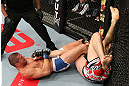 NOTTINGHAM, ENGLAND - SEPTEMBER 29:  (L-R) Matt Wiman secures an arm bar submission against Paul Sass during their lightweight fight at the UFC on Fuel TV event at Capital FM Arena on September 29, 2012 in Nottingham, England.  (Photo by Josh Hedges/Zuffa LLC/Zuffa LLC via Getty Images)