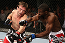 NOTTINGHAM, ENGLAND - SEPTEMBER 29:  (L-R) Brad Pickett punches Yves Jabouin during their bantamweight fight at the UFC on Fuel TV event at Capital FM Arena on September 29, 2012 in Nottingham, England.  (Photo by Josh Hedges/Zuffa LLC/Zuffa LLC via Getty Images)
