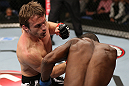 NOTTINGHAM, ENGLAND - SEPTEMBER 29:  (L-R) Brad Pickett punches Yves Jabouin during their bantamweight fight at the UFC on Fuel TV event at Capital FM Arena on September 29, 2012 in Nottingham, England.  (Photo by Josh Hedges/Zuffa LLC/Zuffa LLC via Getty Images)