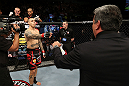 NOTTINGHAM, ENGLAND - SEPTEMBER 29:  Dan Hardy (L) is introduced by Bruce Buffer before his welterweight fight against Amir Sadollah at the UFC on Fuel TV event at Capital FM Arena on September 29, 2012 in Nottingham, England.  (Photo by Josh Hedges/Zuffa LLC/Zuffa LLC via Getty Images)