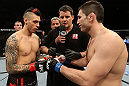 NOTTINGHAM, ENGLAND - SEPTEMBER 29:  Opponents Dan Hardy (L) and Amir Sadollah (R) receive final instructions from referee Mark Goddard before their welterweight fight at the UFC on Fuel TV event at Capital FM Arena on September 29, 2012 in Nottingham, England.  (Photo by Josh Hedges/Zuffa LLC/Zuffa LLC via Getty Images)