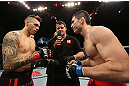 NOTTINGHAM, ENGLAND - SEPTEMBER 29:  Opponents Dan Hardy (L) and Amir Sadollah (R) receive final instructions from referee Mark Goddard before their welterweight fight at the UFC on Fuel TV event at Capital FM Arena on September 29, 2012 in Nottingham, England.  (Photo by Josh Hedges/Zuffa LLC/Zuffa LLC via Getty Images)