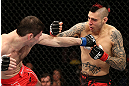 NOTTINGHAM, ENGLAND - SEPTEMBER 29:  (R-L) Dan Hardy punches Amir Sadollah during their welterweight fight at the UFC on Fuel TV event at Capital FM Arena on September 29, 2012 in Nottingham, England.  (Photo by Josh Hedges/Zuffa LLC/Zuffa LLC via Getty Images)
