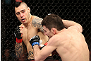 NOTTINGHAM, ENGLAND - SEPTEMBER 29:  (L-R) Dan Hardy punches Amir Sadollah during their welterweight fight at the UFC on Fuel TV event at Capital FM Arena on September 29, 2012 in Nottingham, England.  (Photo by Josh Hedges/Zuffa LLC/Zuffa LLC via Getty Images)
