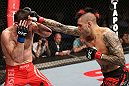 NOTTINGHAM, ENGLAND - SEPTEMBER 29:  (R-L) Dan Hardy punches Amir Sadollah during their welterweight fight at the UFC on Fuel TV event at Capital FM Arena on September 29, 2012 in Nottingham, England.  (Photo by Josh Hedges/Zuffa LLC/Zuffa LLC via Getty Images)