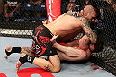 NOTTINGHAM, ENGLAND - SEPTEMBER 29:  (L-R) Dan Hardy delivers an elbow strike against Amir Sadollah during their welterweight fight at the UFC on Fuel TV event at Capital FM Arena on September 29, 2012 in Nottingham, England.  (Photo by Josh Hedges/Zuffa LLC/Zuffa LLC via Getty Images)
