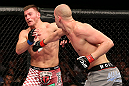 NOTTINGHAM, ENGLAND - SEPTEMBER 29:  (R-L) Strefan Struve punches Stipe Miocic during their heavyweight fight at the UFC on Fuel TV event at Capital FM Arena on September 29, 2012 in Nottingham, England.  (Photo by Josh Hedges/Zuffa LLC/Zuffa LLC via Getty Images)