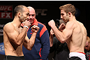 MINNEAPOLIS, MN - OCTOBER 04:  (L-R) Opponents Darren Uyenoyama and Phil Harris face off during the UFC on FX weigh in at Pantages Theater on October 4, 2012 in Minneapolis, Minnesota.  (Photo by Josh Hedges/Zuffa LLC/Zuffa LLC via Getty Images)