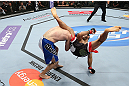 MINNEAPOLIS, MN - OCTOBER 05:  (R-L) Darren Uyenoyama throws a flying kick against Phil Harris during their flyweight fight at the UFC on FX event at Target Center on October 5, 2012 in Minneapolis, Minnesota.  (Photo by Josh Hedges/Zuffa LLC/Zuffa LLC via Getty Images)
