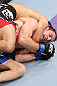 MINNEAPOLIS, MN - OCTOBER 05:  (L-R) Darren Uyenoyama secures a rear choke submission against Phil Harris during their flyweight fight at the UFC on FX event at Target Center on October 5, 2012 in Minneapolis, Minnesota.  (Photo by Josh Hedges/Zuffa LLC/Zuffa LLC via Getty Images)