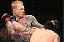 MINNEAPOLIS, MN - OCTOBER 05:  (R-L) Diego Nunes punches Bart Palaszewski during their featherweight fight at the UFC on FX event at Target Center on October 5, 2012 in Minneapolis, Minnesota.  (Photo by Josh Hedges/Zuffa LLC/Zuffa LLC via Getty Images)