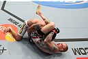 MINNEAPOLIS, MN - OCTOBER 05:  (R-L) Bart Palaszewski attempts a triangle choke submission against Diego Nunes during their featherweight fight at the UFC on FX event at Target Center on October 5, 2012 in Minneapolis, Minnesota.  (Photo by Josh Hedges/Zuffa LLC/Zuffa LLC via Getty Images)