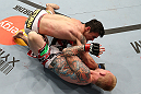 MINNEAPOLIS, MN - OCTOBER 05:  (L-R) Diego Nunes punches Bart Palaszewski during their featherweight fight at the UFC on FX event at Target Center on October 5, 2012 in Minneapolis, Minnesota.  (Photo by Josh Hedges/Zuffa LLC/Zuffa LLC via Getty Images)
