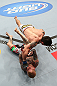 MINNEAPOLIS, MN - OCTOBER 05:   Diego Nunes (top) punches Bart Palaszewski during their featherweight fight at the UFC on FX event at Target Center on October 5, 2012 in Minneapolis, Minnesota.  (Photo by Josh Hedges/Zuffa LLC/Zuffa LLC via Getty Images)