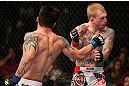 MINNEAPOLIS, MN - OCTOBER 05:  (L-R) Diego Nunes punches Bart Palaszewski during their featherweight fight at the UFC on FX event at Target Center on October 5, 2012 in Minneapolis, Minnesota.  (Photo by Josh Hedges/Zuffa LLC/Zuffa LLC via Getty Images)