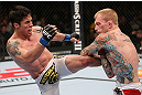 MINNEAPOLIS, MN - OCTOBER 05:  (L-R) Diego Nunes kicks Bart Palaszewski during their featherweight fight at the UFC on FX event at Target Center on October 5, 2012 in Minneapolis, Minnesota.  (Photo by Josh Hedges/Zuffa LLC/Zuffa LLC via Getty Images)