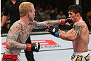MINNEAPOLIS, MN - OCTOBER 05:  (L-R) Bart Palaszewski punches Diego Nunes during their featherweight fight at the UFC on FX event at Target Center on October 5, 2012 in Minneapolis, Minnesota.  (Photo by Josh Hedges/Zuffa LLC/Zuffa LLC via Getty Images)