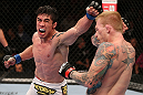 MINNEAPOLIS, MN - OCTOBER 05:  (L-R) Diego Nunes punches Bart Palaszewski during their featherweight fight at the UFC on FX event at Target Center on October 5, 2012 in Minneapolis, Minnesota.  (Photo by Josh Hedges/Zuffa LLC/Zuffa LLC via Getty Images)