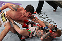 MINNEAPOLIS, MN - OCTOBER 05:  (L-R) Diego Nunes punches Bart Palaszewski during their featherweight fight at the UFC on FX event at Target Center on October 5, 2012 in Minneapolis, Minnesota.  (Photo by Josh Hedges/Zuffa LLC/Zuffa LLC via Getty Images)