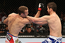 MINNEAPOLIS, MN - OCTOBER 05:  (L-R) Jacob Volkmann punches Shane Roller during their lightweight fight at the UFC on FX event at Target Center on October 5, 2012 in Minneapolis, Minnesota.  (Photo by Josh Hedges/Zuffa LLC/Zuffa LLC via Getty Images)