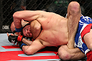 MINNEAPOLIS, MN - OCTOBER 05:  (R-L) Jacob Volkmann secures a rear choke submission against Shane Roller during their lightweight fight at the UFC on FX event at Target Center on October 5, 2012 in Minneapolis, Minnesota.  (Photo by Josh Hedges/Zuffa LLC/Zuffa LLC via Getty Images)
