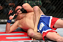 MINNEAPOLIS, MN - OCTOBER 05:  (R-L) Jacob Volkmann secures a rear choke submission against Shane Roller during their lightweight fight at the UFC on FX event at Target Center on October 5, 2012 in Minneapolis, Minnesota.  (Photo by Josh Hedges/Zuffa LLC/Zuffa LLC via Getty Images)
