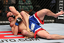 MINNEAPOLIS, MN - OCTOBER 05:  (R-L) Jacob Volkmann secures a rear choke submission against Shane Roller during their lightweight fight at the UFC on FX event at Target Center on October 5, 2012 in Minneapolis, Minnesota.  (Photo by Josh Hedges/Zuffa LLC/Zuffa LLC via Getty Images)