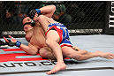 MINNEAPOLIS, MN - OCTOBER 05:  (R-L) Jacob Volkmann secures a rear choke submission against Shane Roller during their lightweight fight at the UFC on FX event at Target Center on October 5, 2012 in Minneapolis, Minnesota.  (Photo by Josh Hedges/Zuffa LLC/Zuffa LLC via Getty Images)