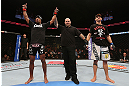 MINNEAPOLIS, MN - OCTOBER 05:  Marcus LeVesseur (L) reacts after defeating Carlo Prater (R) during their lightweight fight at the UFC on FX event at Target Center on October 5, 2012 in Minneapolis, Minnesota.  (Photo by Josh Hedges/Zuffa LLC/Zuffa LLC via Getty Images)