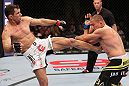 MINNEAPOLIS, MN - OCTOBER 05:  (L-R) Aaron Simpson kicks Mike Pierce during their welterweight fight at the UFC on FX event at Target Center on October 5, 2012 in Minneapolis, Minnesota.  (Photo by Josh Hedges/Zuffa LLC/Zuffa LLC via Getty Images)