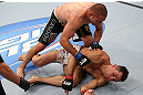 MINNEAPOLIS, MN - OCTOBER 05:  (L-R) Mike Pierce knocks out Aaron Simpson with a series of punches during their welterweight fight at the UFC on FX event at Target Center on October 5, 2012 in Minneapolis, Minnesota.  (Photo by Josh Hedges/Zuffa LLC/Zuffa LLC via Getty Images)