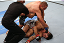 MINNEAPOLIS, MN - OCTOBER 05:  (L-R) Mike Pierce knocks out Aaron Simpson with a series of punches during their welterweight fight at the UFC on FX event at Target Center on October 5, 2012 in Minneapolis, Minnesota.  (Photo by Josh Hedges/Zuffa LLC/Zuffa LLC via Getty Images)