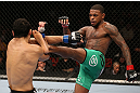 MINNEAPOLIS, MN - OCTOBER 05:  (R-L) Michael Johnson kicks Danny Castillo during their lightweight fight at the UFC on FX event at Target Center on October 5, 2012 in Minneapolis, Minnesota.  (Photo by Josh Hedges/Zuffa LLC/Zuffa LLC via Getty Images)