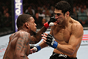 MINNEAPOLIS, MN - OCTOBER 05:  (L-R) Michael Johnson knocks out Danny Castillo with a series of punches during their lightweight fight at the UFC on FX event at Target Center on October 5, 2012 in Minneapolis, Minnesota.  (Photo by Josh Hedges/Zuffa LLC/Zuffa LLC via Getty Images)