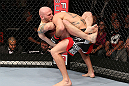 MINNEAPOLIS, MN - OCTOBER 05:  (L-R) Justin Edwards secures a guillotine choke submission to defeat Josh Neer during their welterweight fight at the UFC on FX event at Target Center on October 5, 2012 in Minneapolis, Minnesota.  (Photo by Josh Hedges/Zuffa LLC/Zuffa LLC via Getty Images)