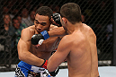 MINNEAPOLIS, MN - OCTOBER 05:  (R-L) Jussier Formiga punches John Dodson during their flyweight fight at the UFC on FX event at Target Center on October 5, 2012 in Minneapolis, Minnesota.  (Photo by Josh Hedges/Zuffa LLC/Zuffa LLC via Getty Images)
