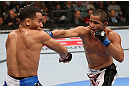 MINNEAPOLIS, MN - OCTOBER 05:  (R-L) Jussier Formiga punches John Dodson during their flyweight fight at the UFC on FX event at Target Center on October 5, 2012 in Minneapolis, Minnesota.  (Photo by Josh Hedges/Zuffa LLC/Zuffa LLC via Getty Images)