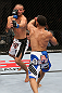 MINNEAPOLIS, MN - OCTOBER 05:  (R-L) John Dodson punches Jussier Formiga during their flyweight fight at the UFC on FX event at Target Center on October 5, 2012 in Minneapolis, Minnesota.  (Photo by Josh Hedges/Zuffa LLC/Zuffa LLC via Getty Images)