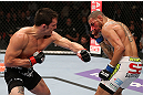 MINNEAPOLIS, MN - OCTOBER 05:  (L-R) Jake Ellenberger punches Jay Hieron during their welterweight fight at the UFC on FX event at Target Center on October 5, 2012 in Minneapolis, Minnesota.  (Photo by Josh Hedges/Zuffa LLC/Zuffa LLC via Getty Images)