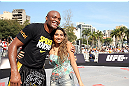 RIO DE JANEIRO, BRAZIL - OCTOBER 10:  Anderson Silva poses for a photo with a fan after an open training session ahead of UFC 153 at Arcos da Lapa: Praca Cardeal Camara on October 10, 2012 in Rio de Janeiro, Brazil.  (Photo by Josh Hedges/Zuffa LLC/Zuffa LLC via Getty Images)