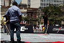 RIO DE JANEIRO, BRAZIL - OCTOBER 10:  Workers spread ice to cool the mats before the UFC 153 open workouts at Arcos da Lapa: Praca Cardeal Camara on October 10, 2012 in Rio de Janeiro, Brazil.  (Photo by Josh Hedges/Zuffa LLC/Zuffa LLC via Getty Images)