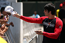 RIO DE JANEIRO, BRAZIL - OCTOBER 10:  Erick Silva greets fans before an open training session ahead of UFC 153 at Arcos da Lapa: Praca Cardeal Camara on October 10, 2012 in Rio de Janeiro, Brazil.  (Photo by Josh Hedges/Zuffa LLC/Zuffa LLC via Getty Images)